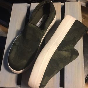 Steve Madden camouflage slip on sneakers.